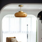 Plafond i mässing med bärnstensfärgat glas
