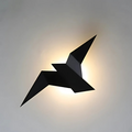Vägglampa i origamiform