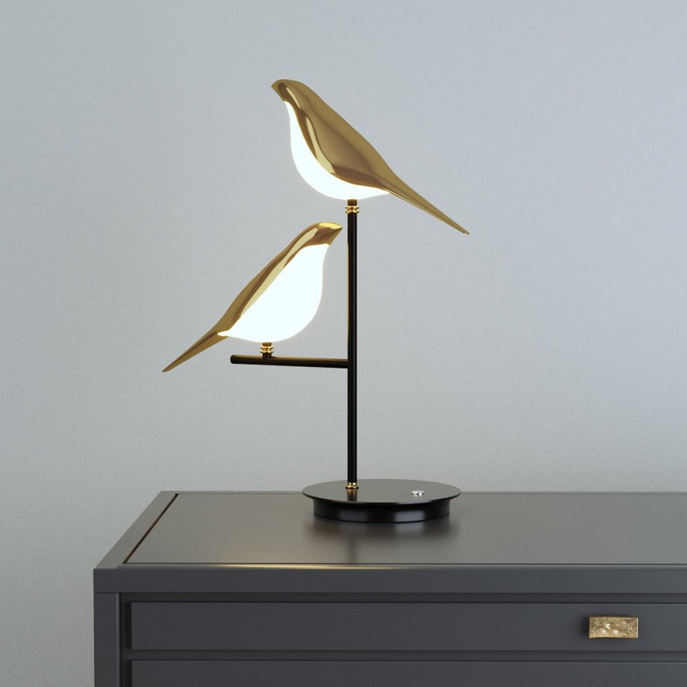 Vägglampa med fågelmotiv i guld