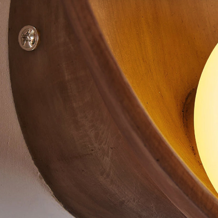 Rund vägglampa i resin