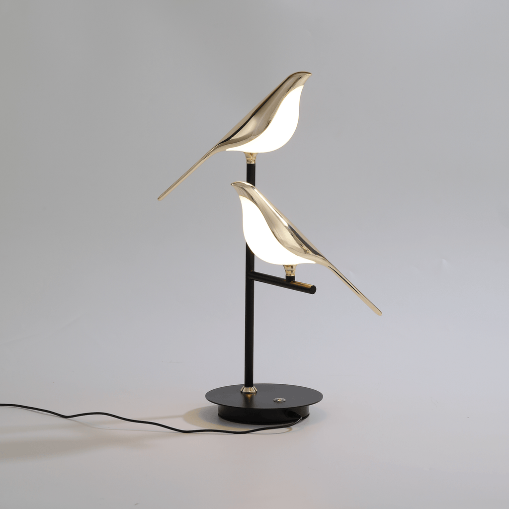 Vägglampa med fågelmotiv i guld