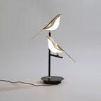 Vägglampa med fågelmotiv i guld
