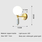 Vägglampa i marmor och glas