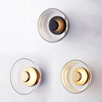 Rund vägglampa i glas