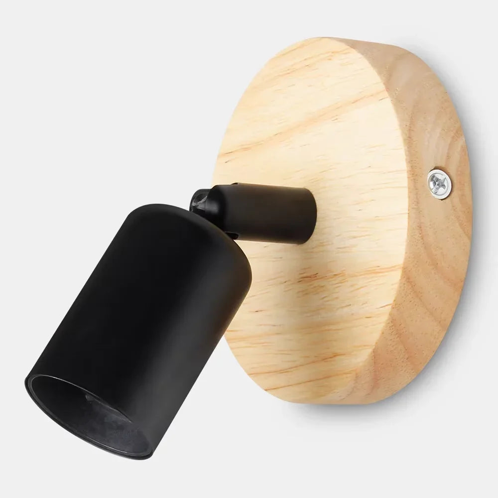Vägglampa i trä och metall med vridbar arm
