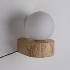 Vägglampa i travertin och frostat glas