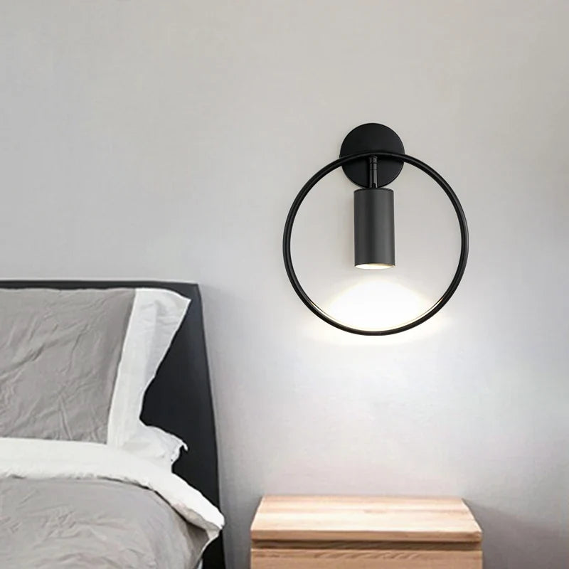 Vägglampa med roterbar ring