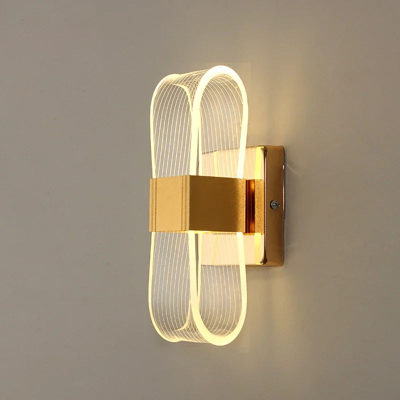 Vägglampa i aluminium med loopform