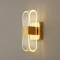 Vägglampa i aluminium med loopform