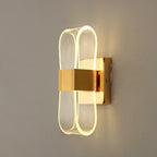 Vägglampa i aluminium med loopform