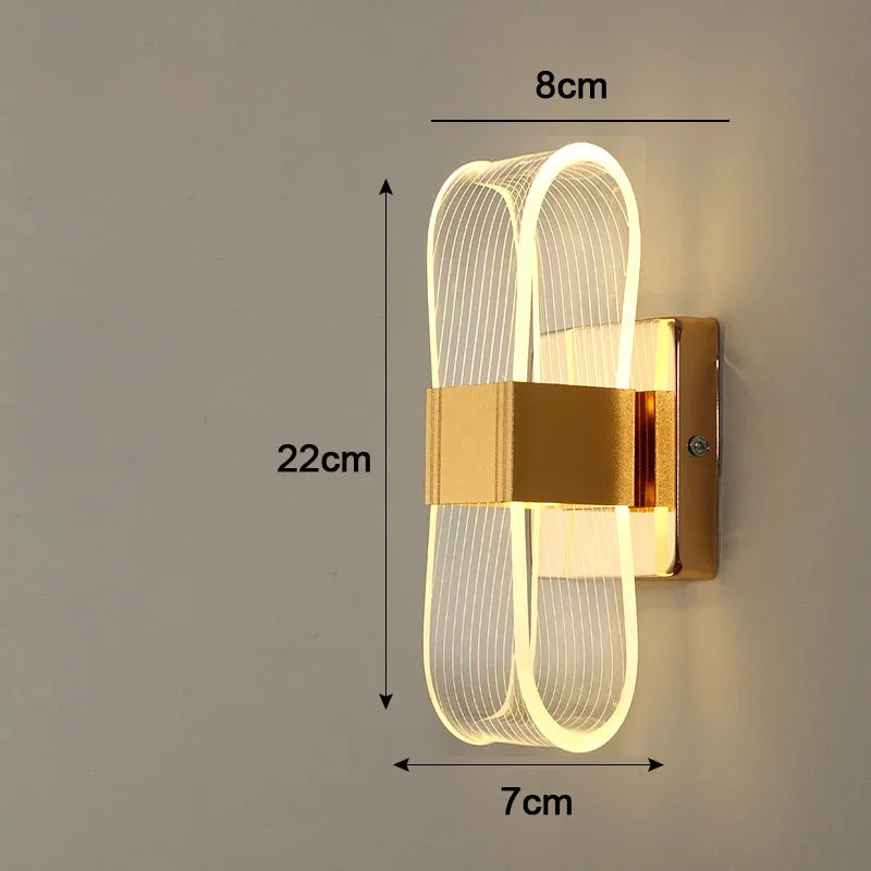 Vägglampa i aluminium med loopform