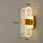 Vägglampa i aluminium med loopform