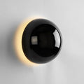 Vägglampa med rund skiva och halo-ljus