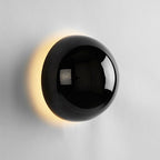 Vägglampa med rund skiva och halo-ljus